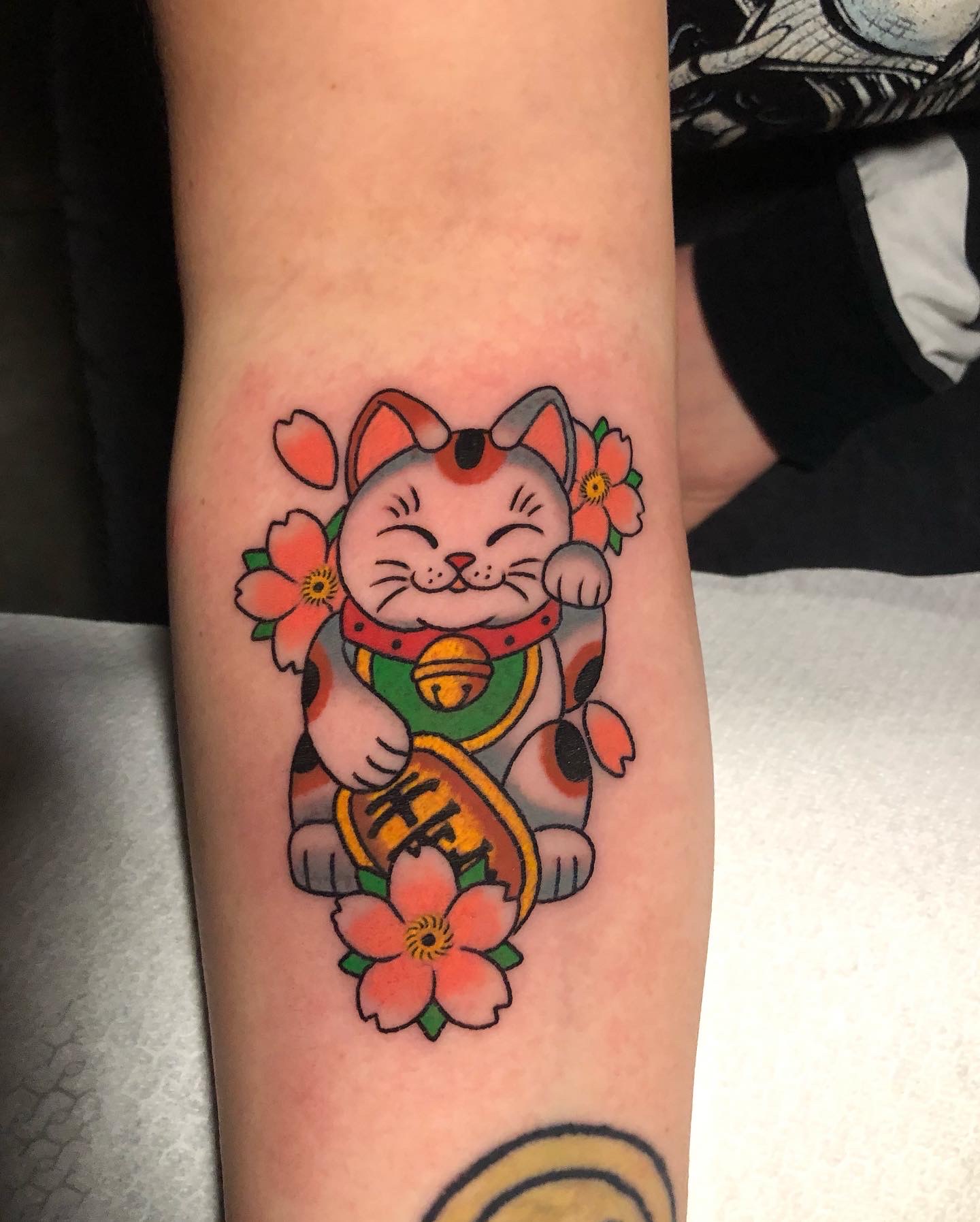 Tatuaggio traditional con maneki-neko